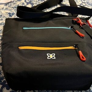 Sherpani Black Crossbody Bag with Blue and Orange Zippers